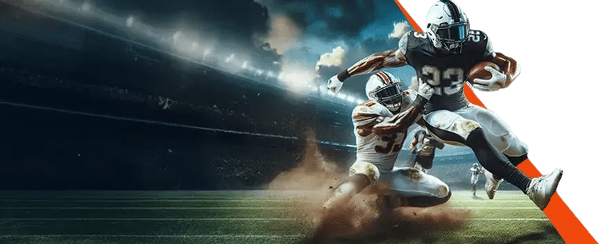 Two American football players in action on a stadium field, with one player running with the ball while another attempts to tackle him, under dramatic stadium lighting.