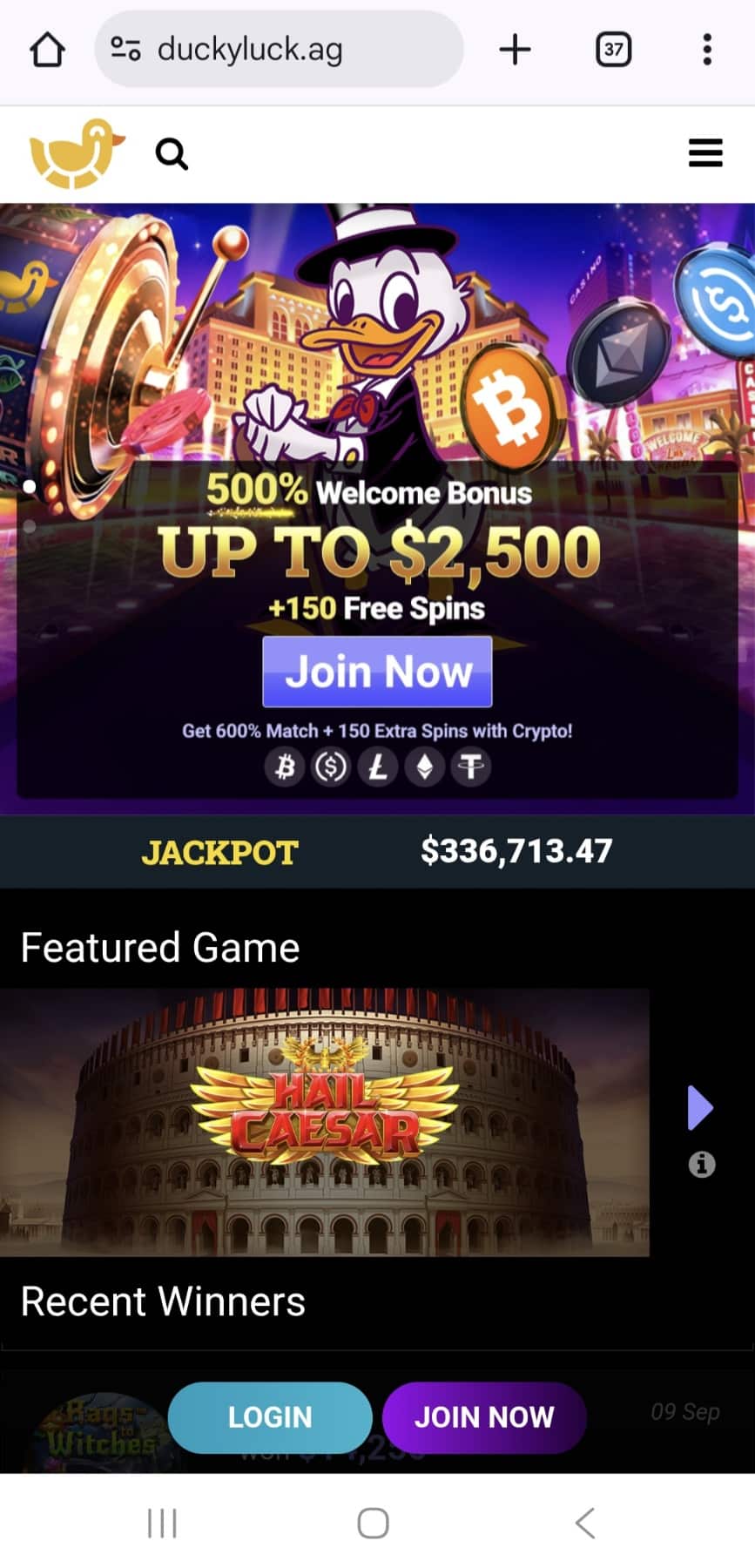 A screenshot of the home page of the DuckyLuck casino mobile version of the website, with a graphic image of the ducky, casino buildings, roulette and checkers.