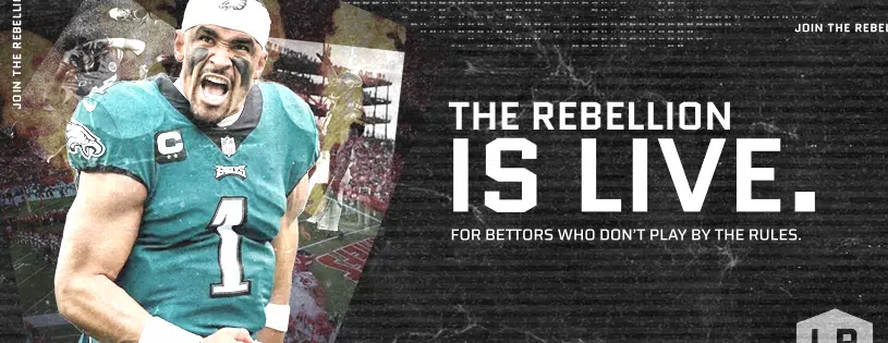 Football player celebrating in front of a stadium with the text ‘The Rebellion is Live. For bettors who don’t play by the rules.’ and Lucky Rebel branding.