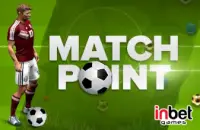 Soccer player in red uniform standing next to a ball on a green field with the text ‘Match Point’ and the inbet games logo.