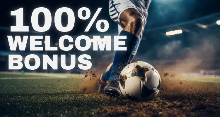 Soccer player kicking a ball on a stadium field with text overlay reading ‘100% Welcome Bonus’ promoting a sports betting offer.