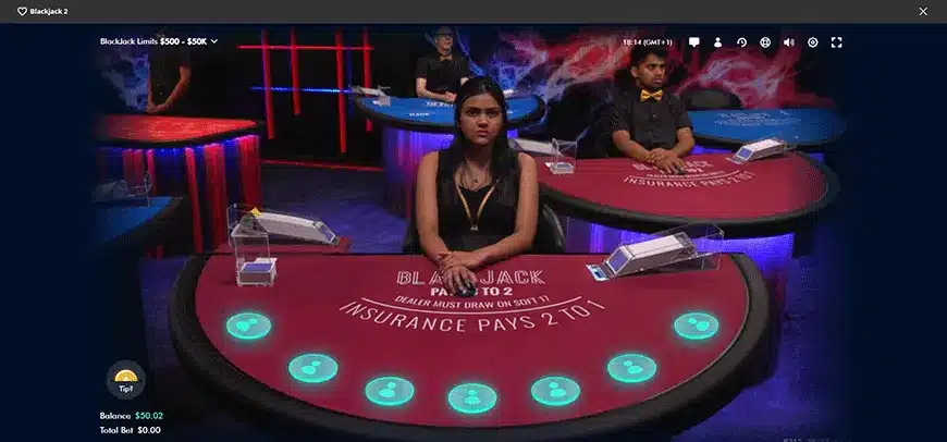 A screenshot of BetOnline's live blackjack casino experience, with three live dealers sat at tables.